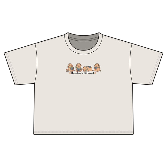 Women's Bookish Crop Tee – "Cozy Capybara Fully Booked"
